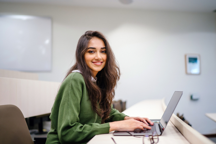 Why your small business should hire interns young lady intern smiling
