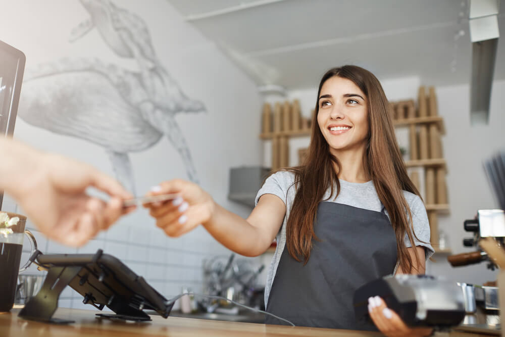 Handing money to small business owner woman