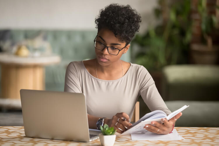 first time business owner focused lady at computer