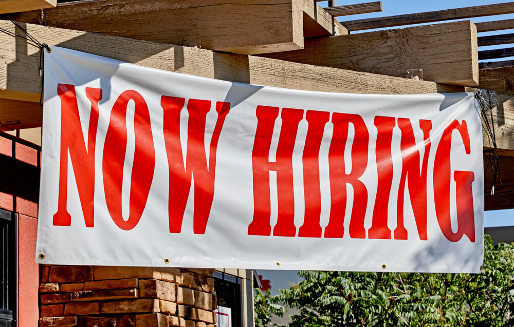 Now hiring sign 