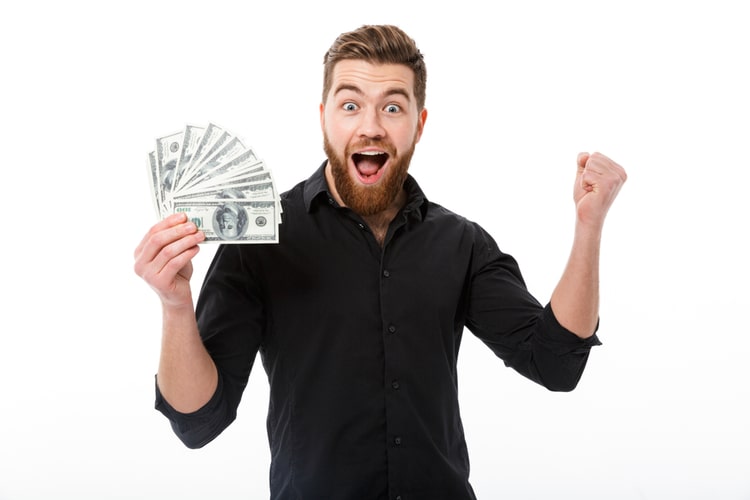 Man holding cash advance money after approval.