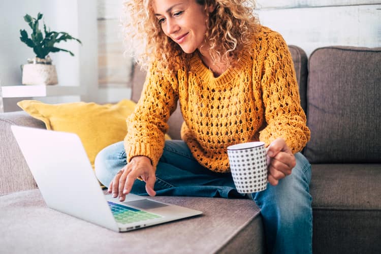 Woman helping friend using online chat.