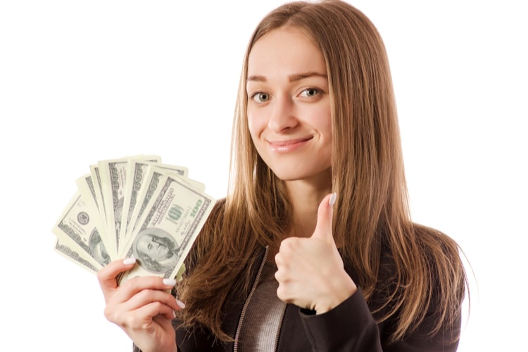 Woman holding funds from secured loan.